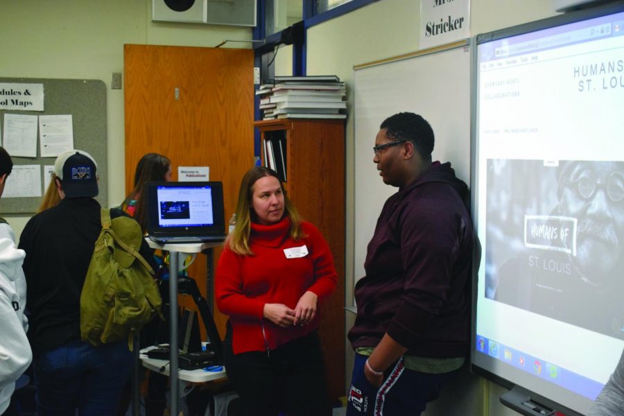 Senior AJ Collier talks with Ms. Lindy Drew after the Humans of St. Louis presentation. Humans of St. Louis is a non-profit that shares images and stories of people in the St. Louis region. They share the stories across multiple media platforms to spread awareness.