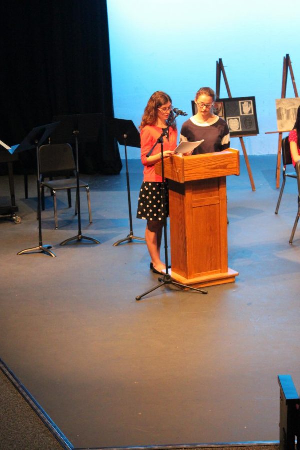 PCH Corral Editor-in-chief Athena Stamos and Copy Editor Maddie Lee announcing the inductees of the Quill and Scroll Honors Society at the Inductee ceremony.