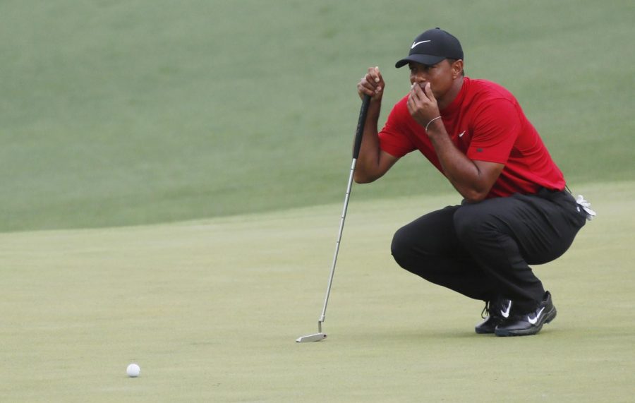 Tiger Woods lines up his putt on 2 during the final round of the Masters on Sunday, April 14, 2019, at Augusta National Golf Club in Augusta, Ga. (Bob Andres/Atlanta Journal-Constitution/TNS)