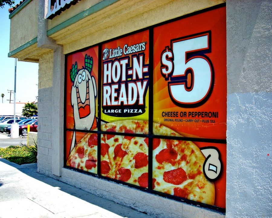 A promotional spread for the $5 Hot-N-Ready pizza deal.