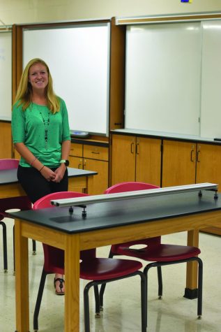 Hannah Merriman poses for a picture in her new science classroom