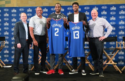 From left, Los Angeles Clippers President of Basketball Operations Lawrence Frank, head coach Doc Rivers, new players Paul George and Kawhi Leonard and owner Steve Balmer, at Green Meadows Recreation Center during a news conference in Los Angeles on Wednesday, July 24, 2019. (Wally Skalij/Los Angeles Times/TNS)