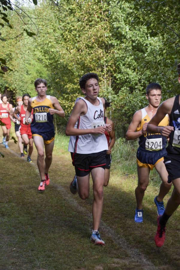 Junior Jackson Shanker runs the final stretch at the Suburban Conference meet.