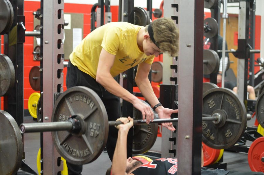 Matt Mendel (12) spotting Shamus Landry (12) in the weight room