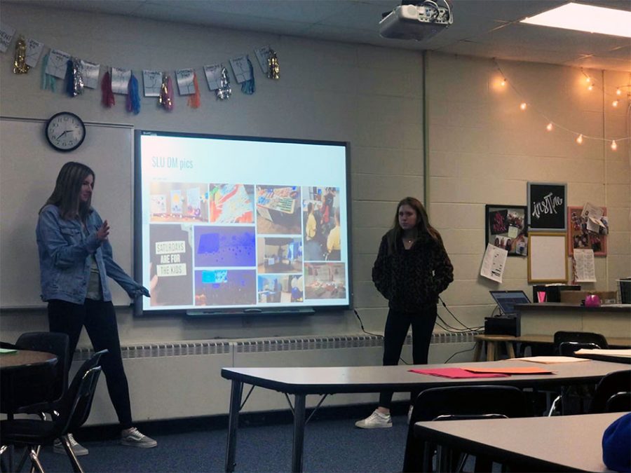 Executive directors juniors Sophie Sokolik and Sydney Kolker leading a weekly Dance Marathon meeting. They are going over a Dance Marathon event hosted by St. Louis University and what they want to bring to PCH from their event. Photo by Rebecca Barnholtz.