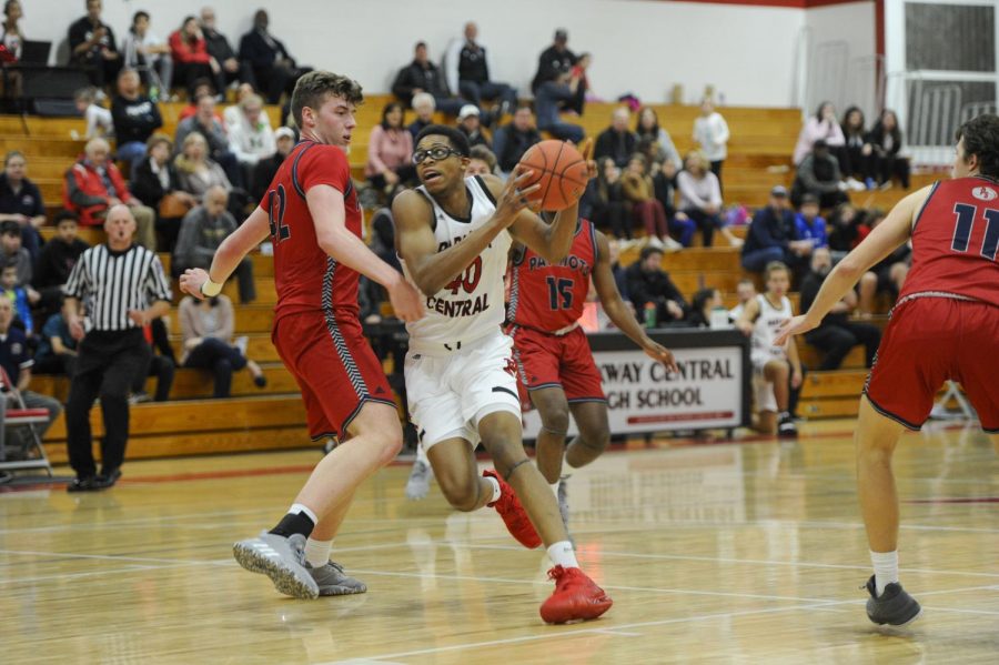 Senior Devion Harris taking the basketball towards the hoop  on Dec. 6 at the game against Parkway South. 