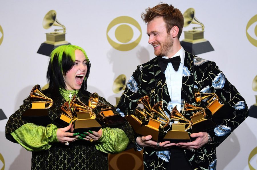 Billie+Eilish+and+her+brother+and+producer+Finneas+O%E2%80%99Connell+holding+the+10+total+Grammys+they+won