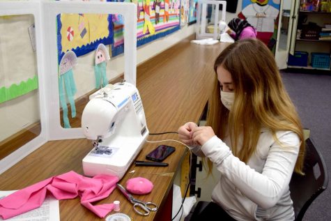 Zoe Snitzer (9) sews a pin cushion during Fashion Apparel and Housing Design class on her last day of in-person learning on Nov. 20.  Snitzer attended just four days of in-person school before the district decided that middle and high school would return to virtual learning for the remainder of the second quarter.  