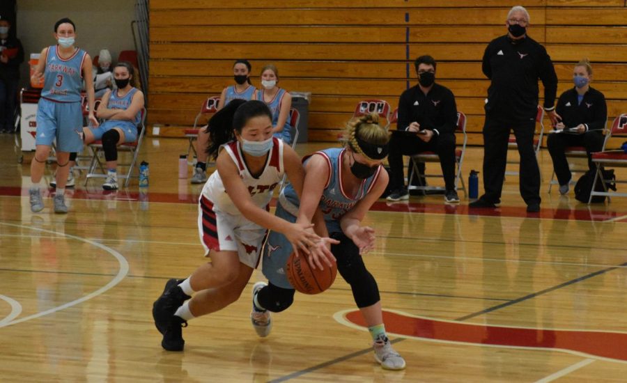 Sophomore Maggie Roberts goes to steal the ball at the game against Parkway West on Jan. 11. 