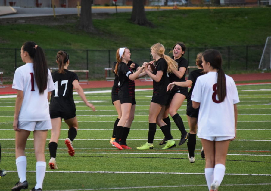 Soccer players celebrate Emily Landers goal in the game against MICDS on April 12.  The Colts beat the Rams 2-1 