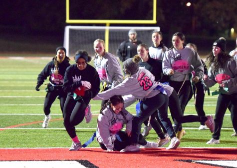 Kaye Tate (12) sneaks into the endzone during the Powderpuff game on Nov. 22.  The seniors defeated the juniors 14-7. 