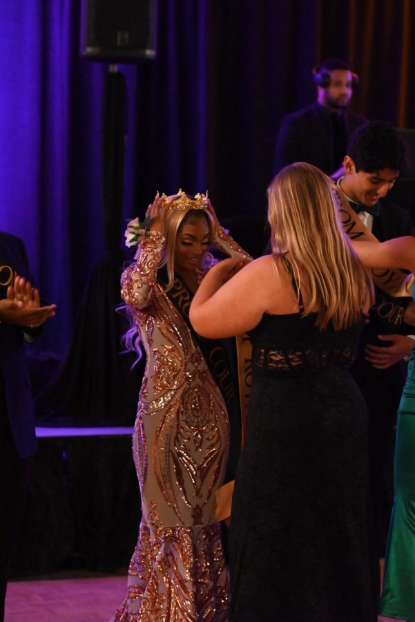 Brittanee Jackson (12) and Ayaan Umar (12)accept Prom court crowns and sashes. Students at Prom 2022 held at the Sheraton