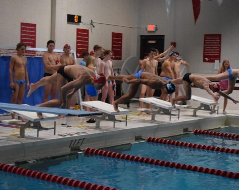Junior William Jost dives in for the 50 freestyle on Senior Night against Parkway West. Check out Landon Chens Article Boys Swim Makes A Splash by in your Corral newspaper (can be found in school) or on pchcorral.com soon.