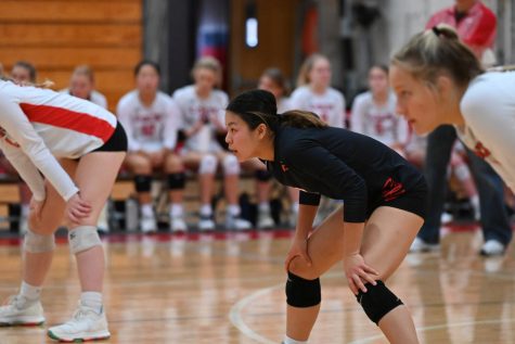 Senior libero Josie Robinson gets ready in serve receive against the Red Knights. Photos by Christine Stricker  