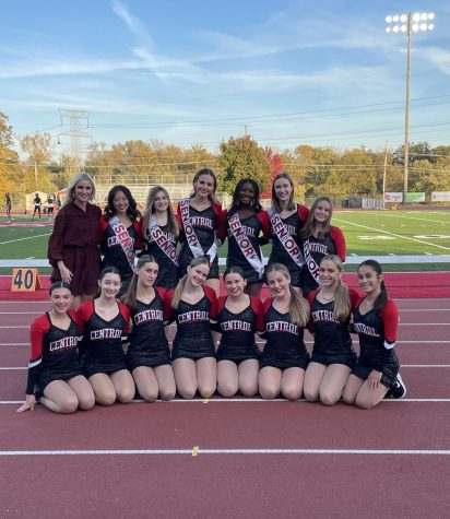 Dance coach Sommer Schaefer coaches the girls during the District Championship game on Oct. 29. Near right, the team poses on senior night. 