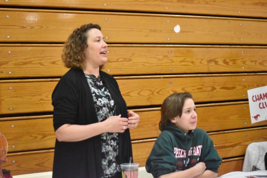 Orchestra teacher Alicia Bont and sophomore Camden Lovera talk to parents at the orchestra table. “We had a range from orchestra to every sport to world languages to core classes.” Lovera said, “ It was an excellent way for the incoming freshmen to learn what they're going to be able to do as a freshman. This is certainly something I wish I had as a freshman.”