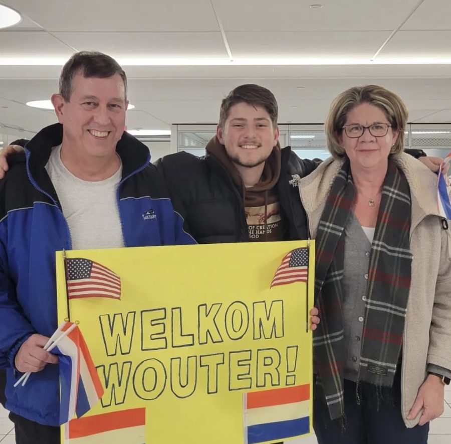 Wouter Kapman (Center) stands with his host-parents, Laura (right) and McLeod Patton (left) after arriving in America.