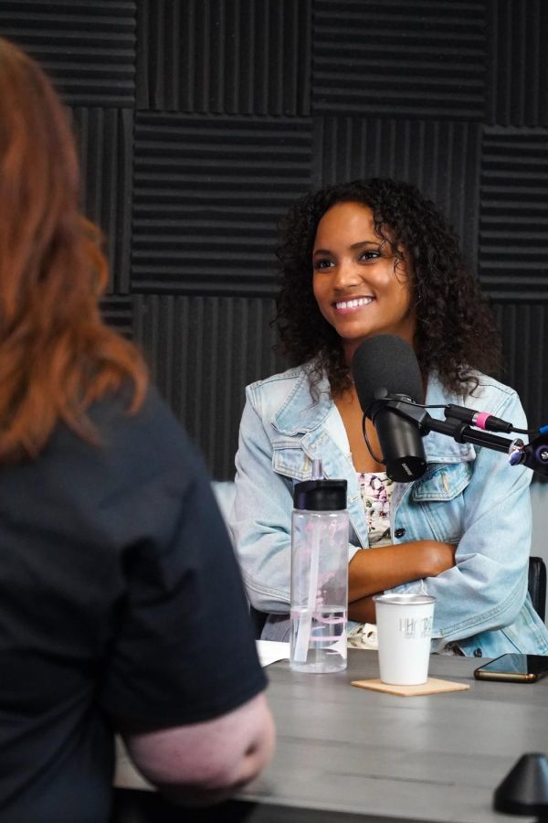 Marrissa Farrell, a young black women, sits in a podcast studio