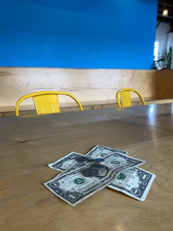 Money left behind by a diner at a restaurant. Photo by Gabrielle Williams. 
