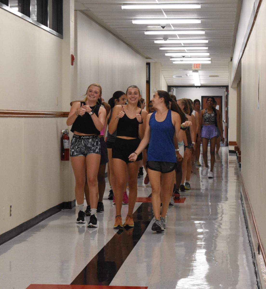 Girls+Cross+Country+team+combats+against+harsh+weather+to+continue+training.+%0AAthletes+for+cross+country%2C+football%2C+softball%2C+soccer+and+field+hockey+train+inside+by+running+through+the+hallways+and+using+the+gyms+and+weight+rooms.+From+left+to+right+is+Amelia+Stumpe+%2812%29%2C+Sophia+Burk+%2811%29%2C+Natalie+Duvall+%2810%29.+