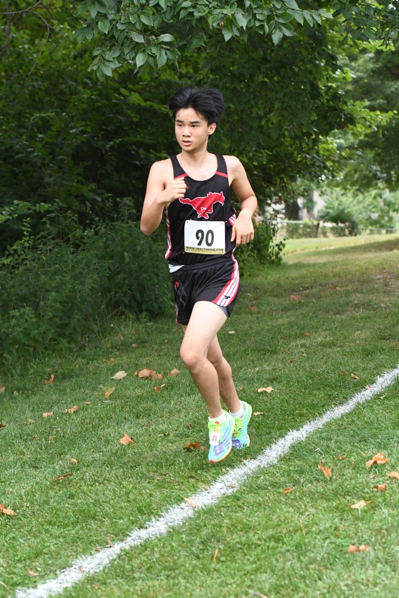 Junior Landon Chen runs at the Parkway Quad cross country meet on Aug. 28