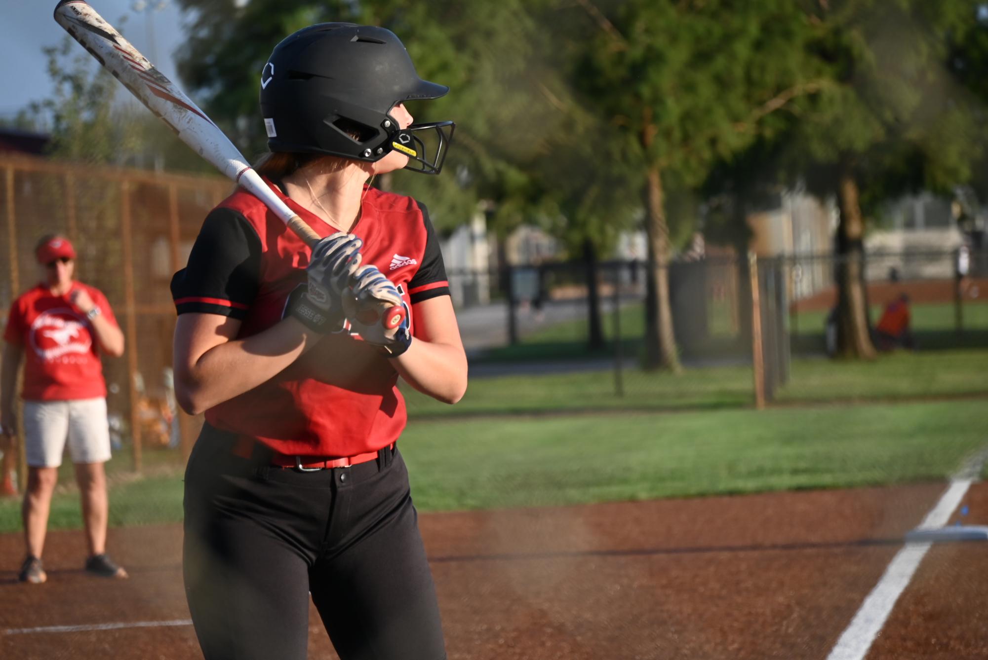 Kyndall Jesse (12) stands in looking for a pitch against Francis Howell North on Aug. 28. Jesse is batting 302 as of Sept. 29. 