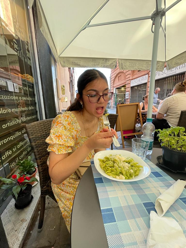 Senior Kriti Dhaduvai eats pasta in cabella ligure over the summer. "Best of all," Kristi said, "the food is ten out of ten, life changing. Pesto is life." 