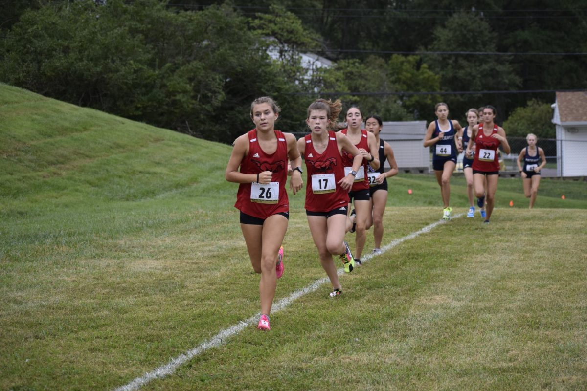 Senior Sarah Williams and sophomore Maddy Qian run at the Parkway Quad meet on Aug. 26. They are the top runners in the girls cross country team. Williams was placed third and Qian was placed fifth in this meet. 