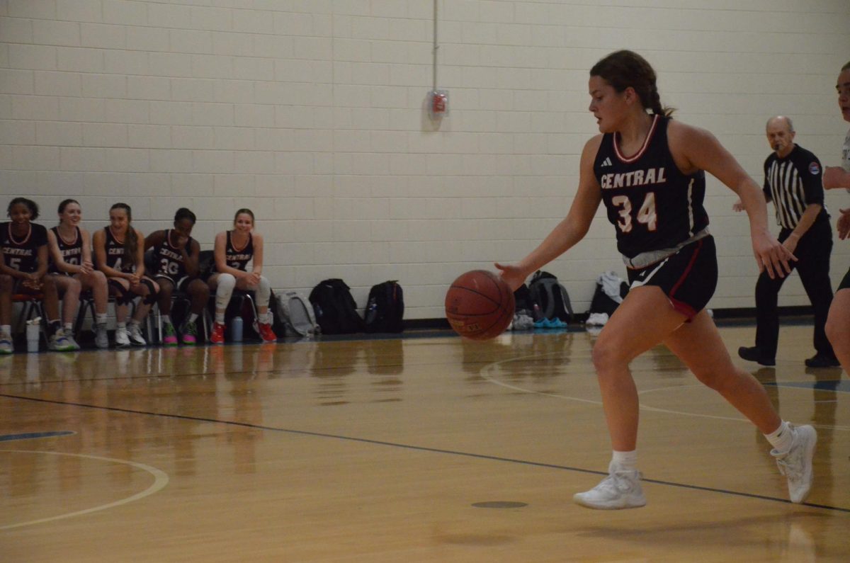 Kaitlyn+King+%2812%29+dribbles+down+the+court+on+Nov.+13+against+Whitfield.+