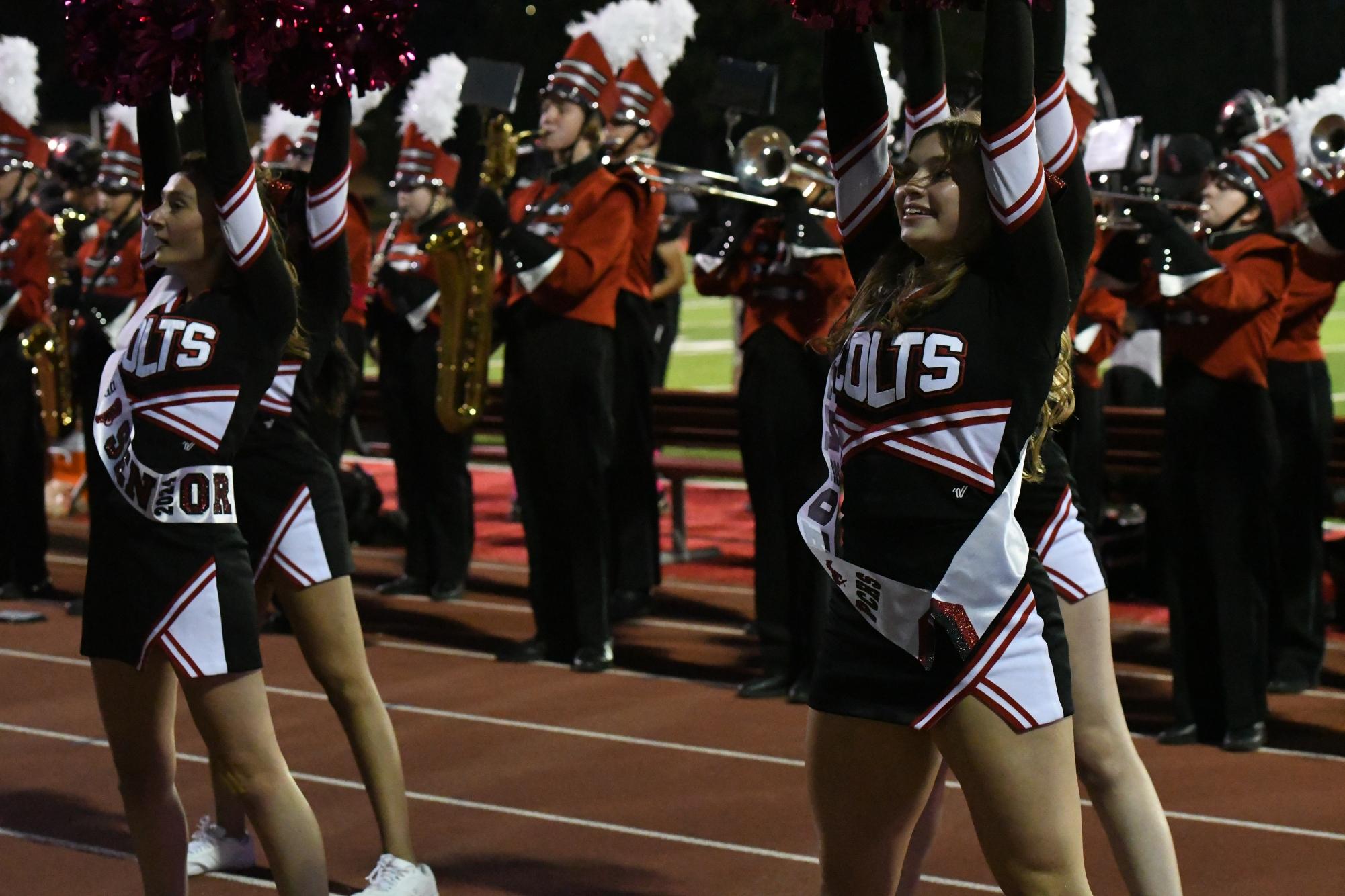 Senior Captains Elaina Malt and Julia Engelhardt cheer against Parkway West on senior night. 