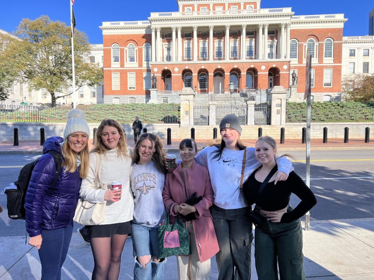 Journalism teacher Christine Stricker poses with Brie Williams (12), Maya Sagett (12), Alyssa Davis (12), Avery Adams (11) and Sasha Smith (11) for a picture in Boston.