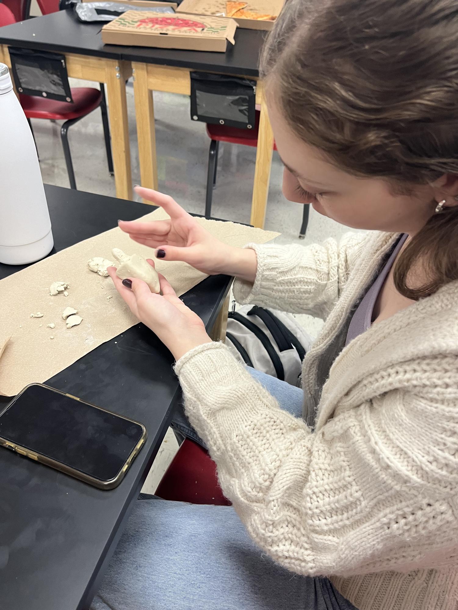Abi Kornblum (12) making dreidels to celebrate Hanukkah on Dec. 6.
