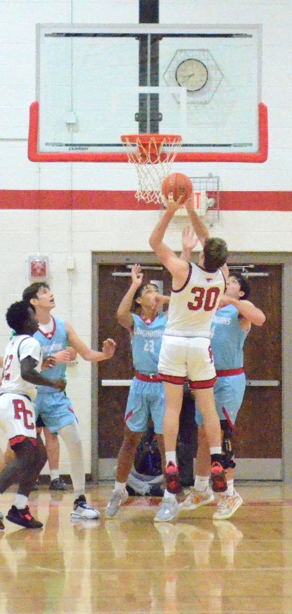 Caleb Mues going up for a basket at the Talk 4 Tyler game on Nov. 28. “I didn’t really get much playing time but I did have a few points and I feel like it definitely helped the outcome of the game,” Mues said.