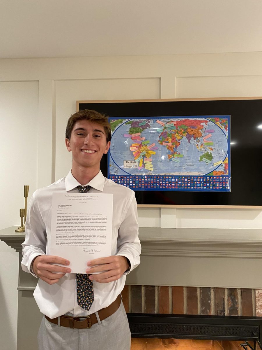 Ben Lake poses with his acceptance letter to his upcoming mission trip. Photo courtesy of Ben Lake.