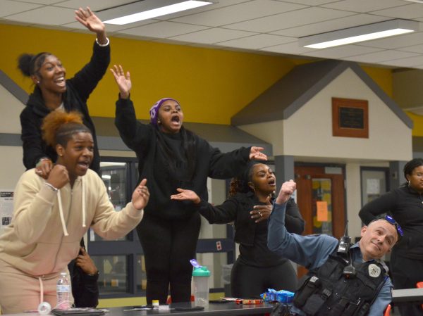 Students yell answers to jeopardy during the cookout hosted by Black Student Union (BSU) on Wednesday, March, 28. This is the first ever BSU hosted cookout to celebrate black history month.