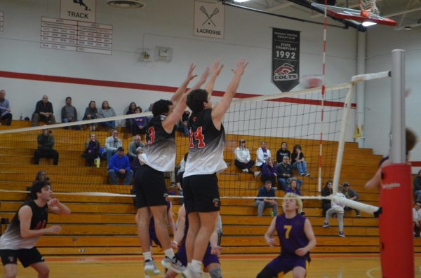 Connor Lander and Cole Hoehn go up for a block during the game against Eureka on March 28.  The game was a close one, going to five sets with the Colts falling just short, 13-15. 