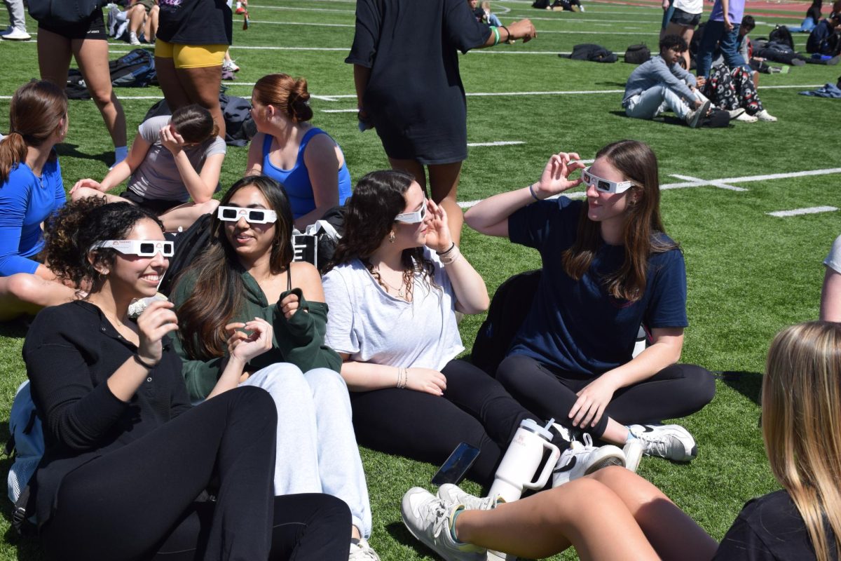 Monday%2C+April+8%2C+juniors+have+fun+wearing+the+solar+eclipse+glasses+and+enjoying+the+view.+The+whole+school+gathered+together+to+watch+the+eclipse+in+98%25+totality+and+enjoy+time+with+friends.+