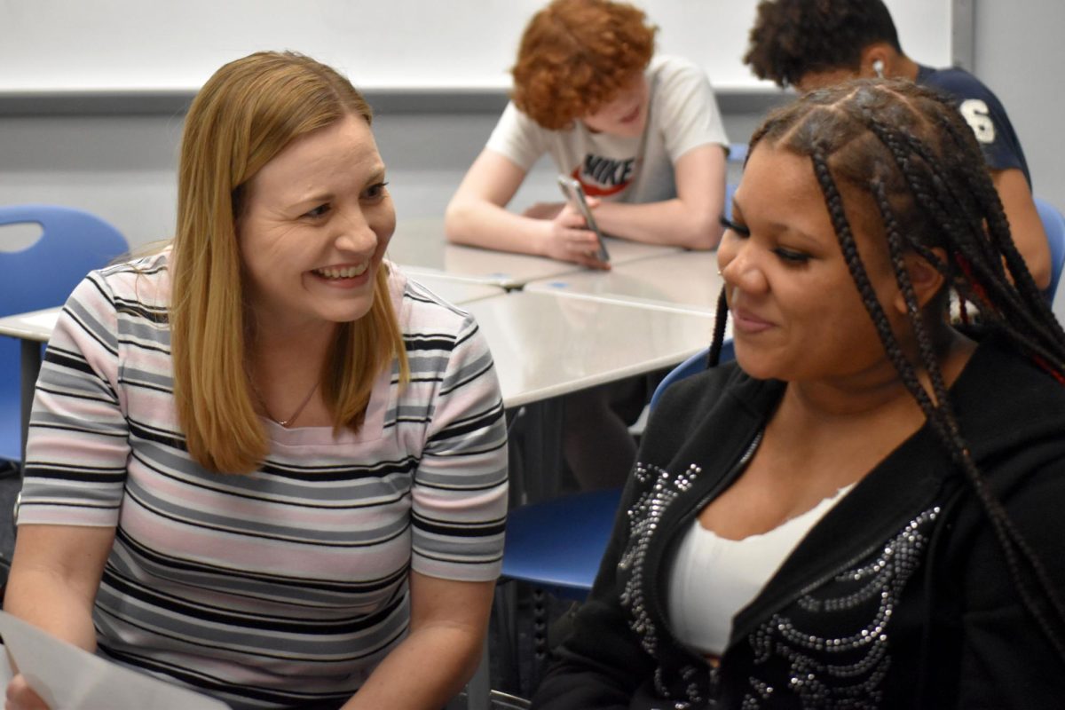 Spanish teacher Andrea Williamson guides Kiara Petty (10) through a Spanish speaking assessment.