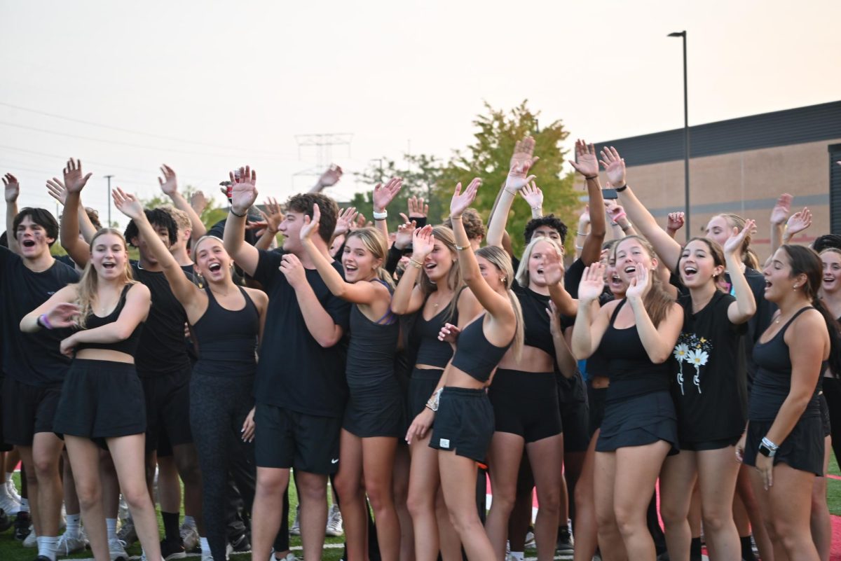 Seniors show off their spirit after winning the class kickball game against the juniors.