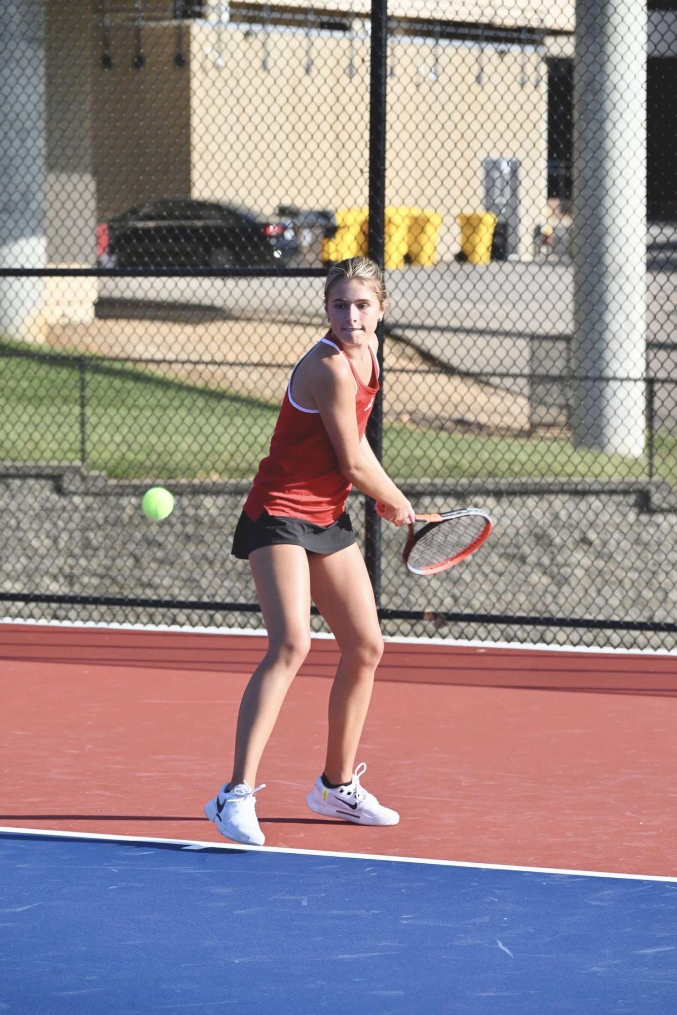 Emily Heller (12) hits a backhand in a match against Parkway South on Sept. 6. The Colts beat the Patriots 8-1.