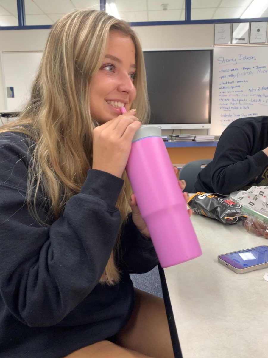 Senior Brooke Williams shows off her Owala water bottle at lunch.