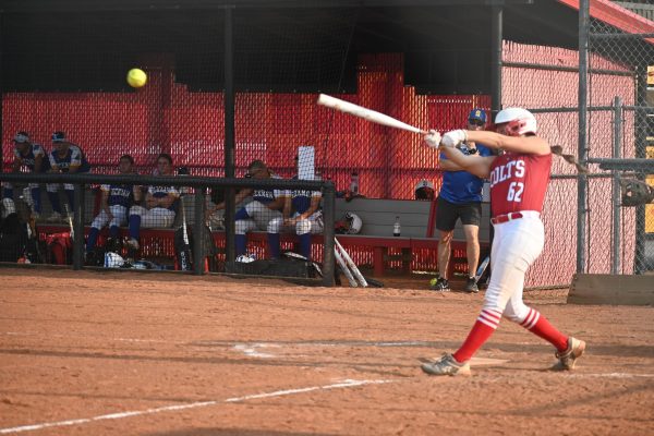 Gabie Klaven (10) hits a line drive against Seckman on Sept. 10.  Klaven pitched seven innings collecting seven strikeouts. 