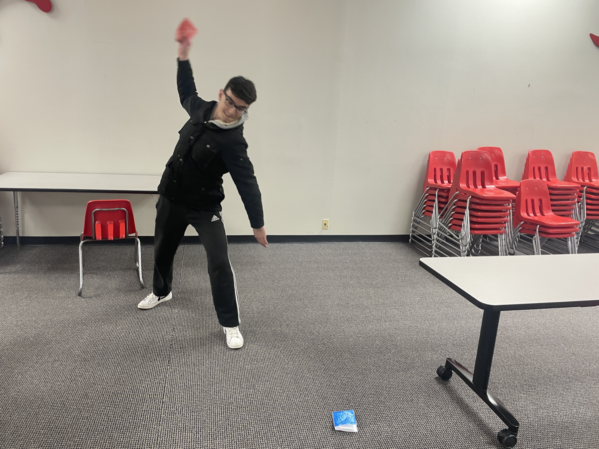 Amir Esmaeeli (12) plays Ddakji in the social studies commons.