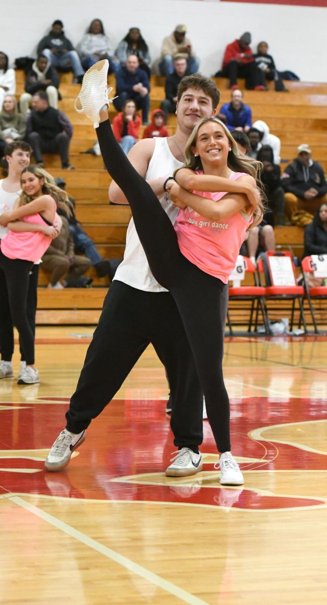 Amanda Gubernik (12) and Charlie Solomon (12) dance during the guy girl dance at Parkway Central.