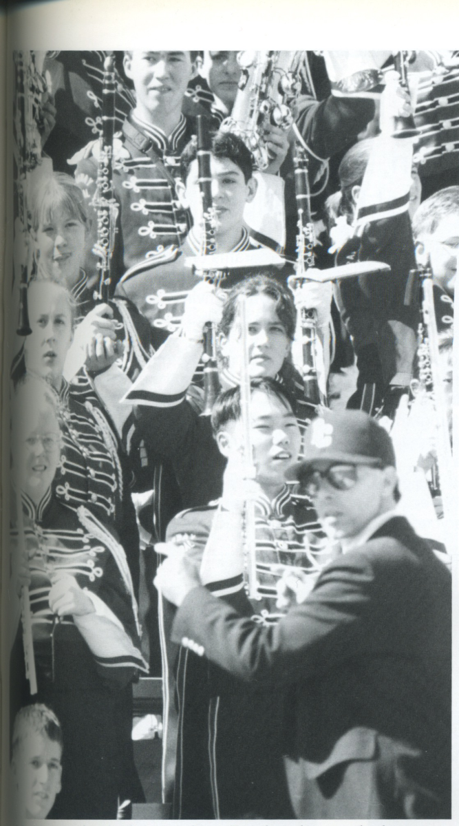 Doug Hoover leads the marching band during a football game in 1997. 