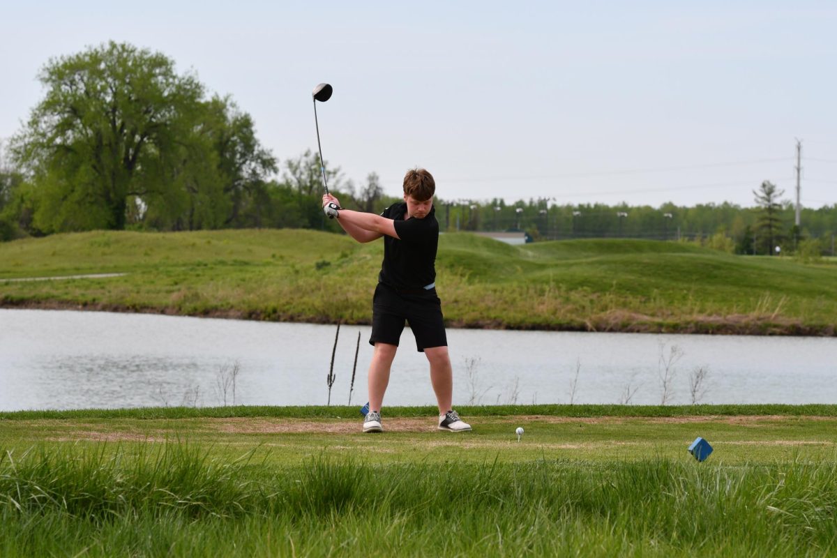 Evan Falke (11) swings  the club at The Quarry at Crystal Springs on April 23 for senior night. 