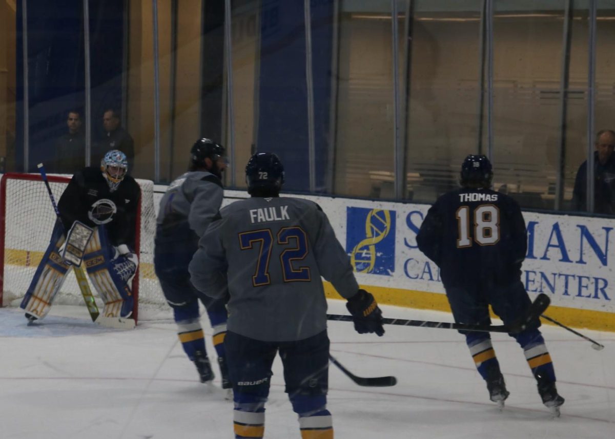Forward Robert Thomas (18) skating beside the net along with teammate's Nick Leddy (4) and Justin Faulk (72) at Blues training camp on Sept. 21