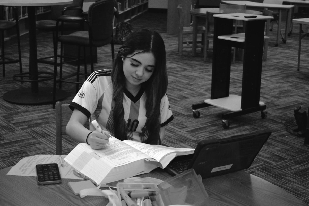 Candelaria Perez (11) studies for her virtual ACT Prep course in the library on Friday, May 2. 