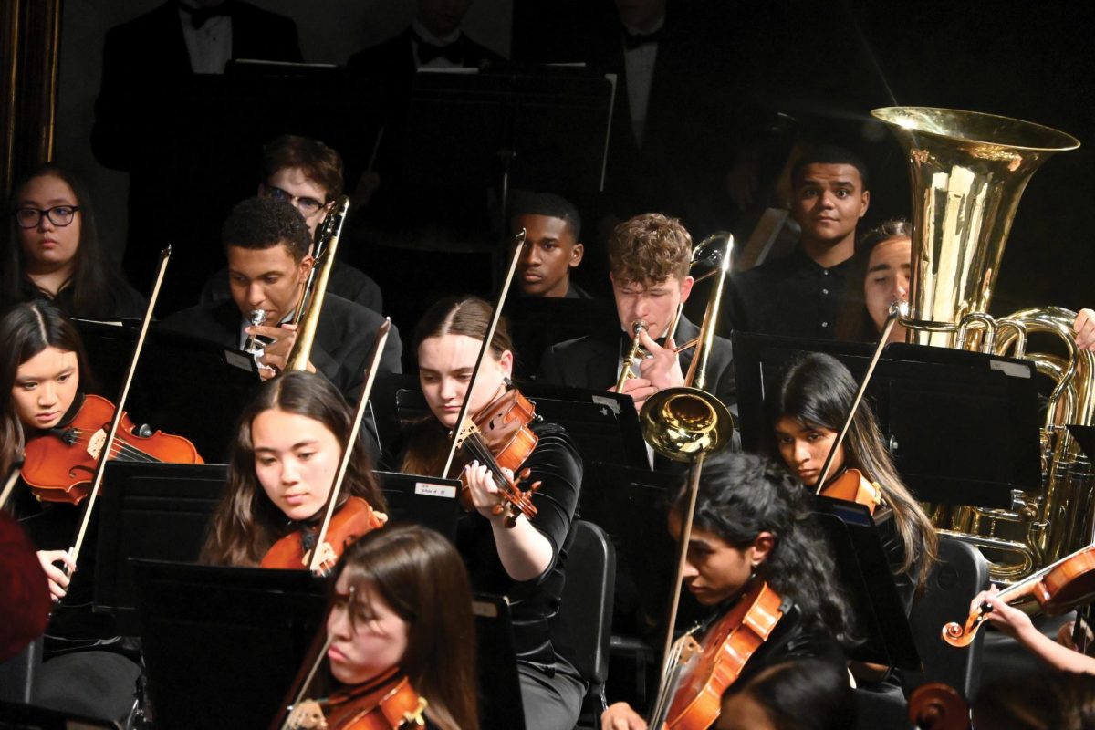 Symphonic orchestra students and band students performed together during the spring concert on April 30. Spring concert usually features a full orchestra performance.  This year, the orchestra and band performed “Singin’ in the Rain” and “Danse Macabre” together. 
