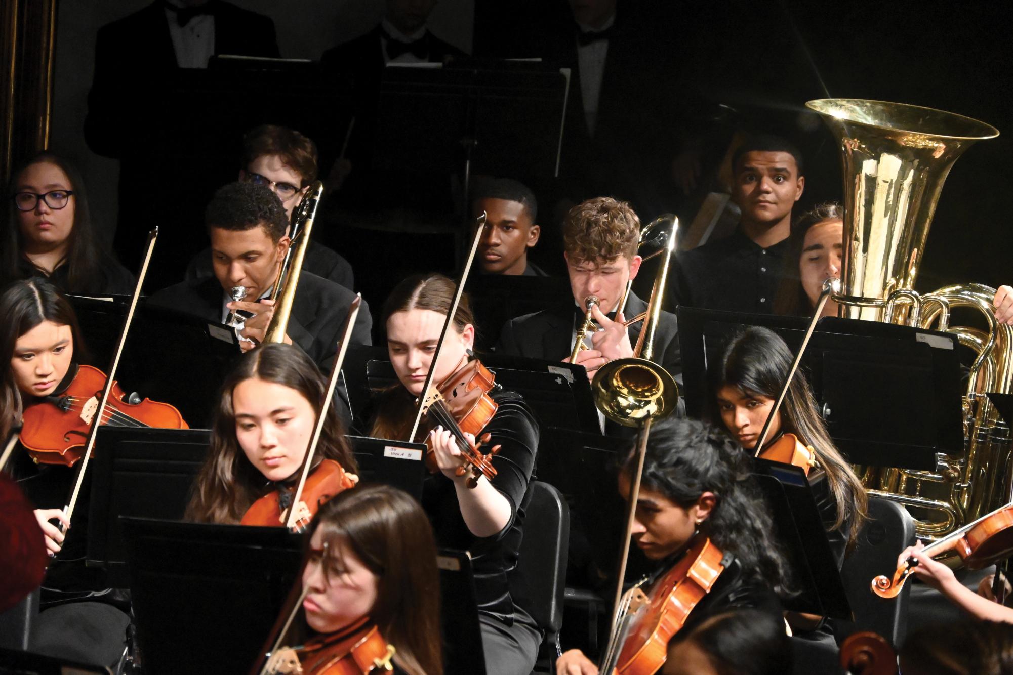 Symphonic orchestra students and band students performed together during the spring concert on April 30. Spring concert usually features a full orchestra performance.  This year, the orchestra and band performed “Singin’ in the Rain” and “Danse Macabre” together. 